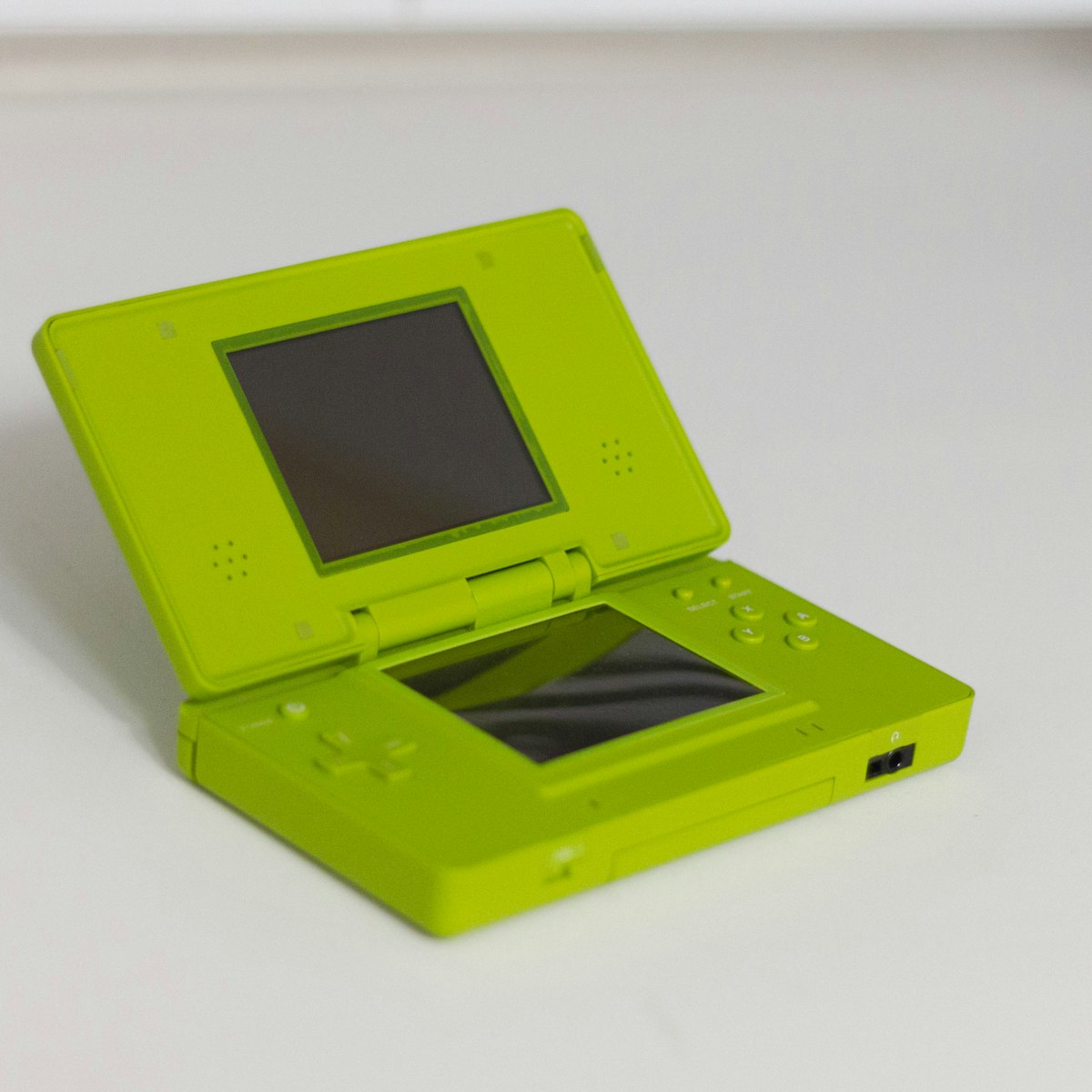 Nintendo DS handheld console open showing both screens