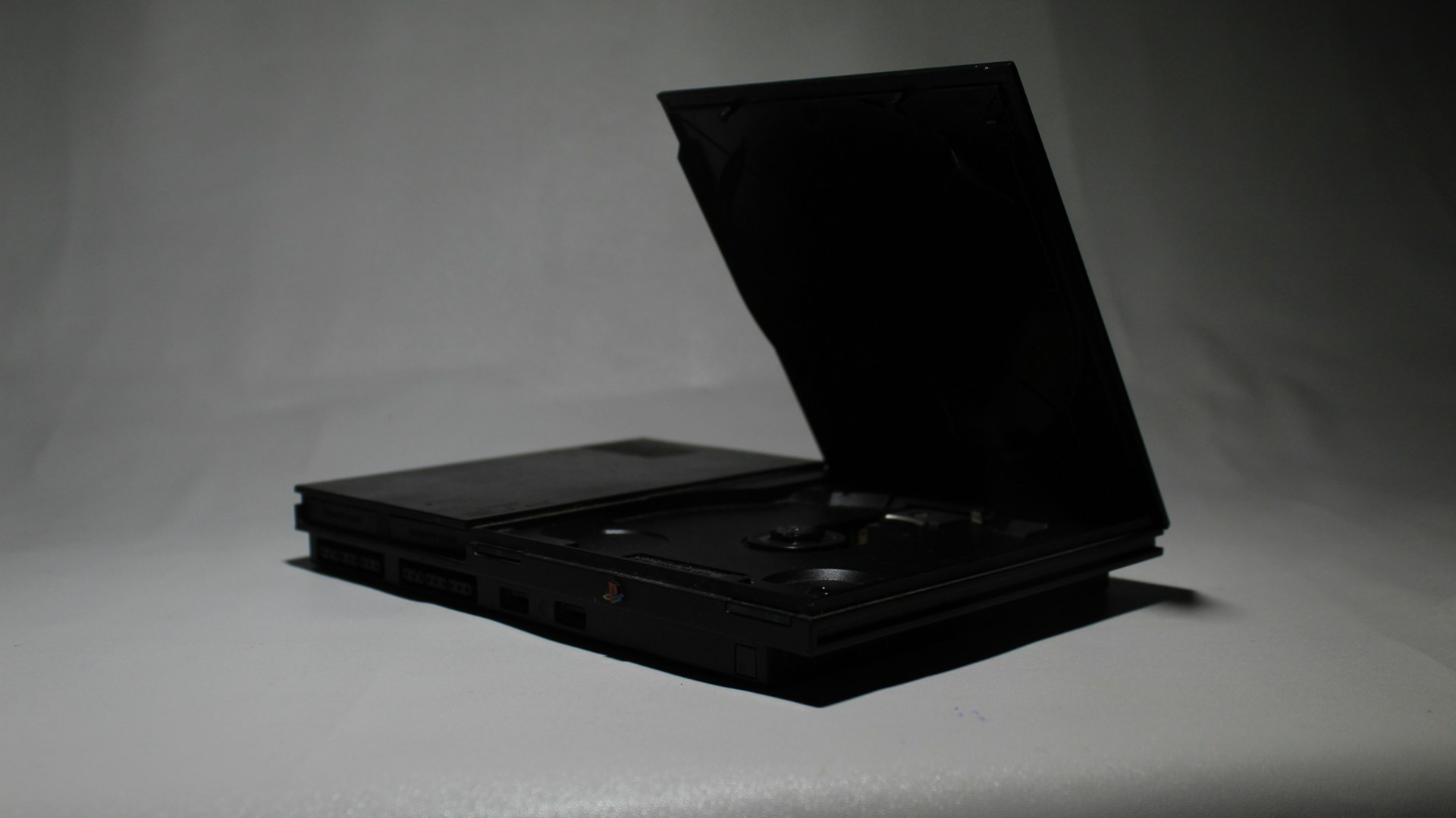 PlayStation 2 Slim console with disc tray open