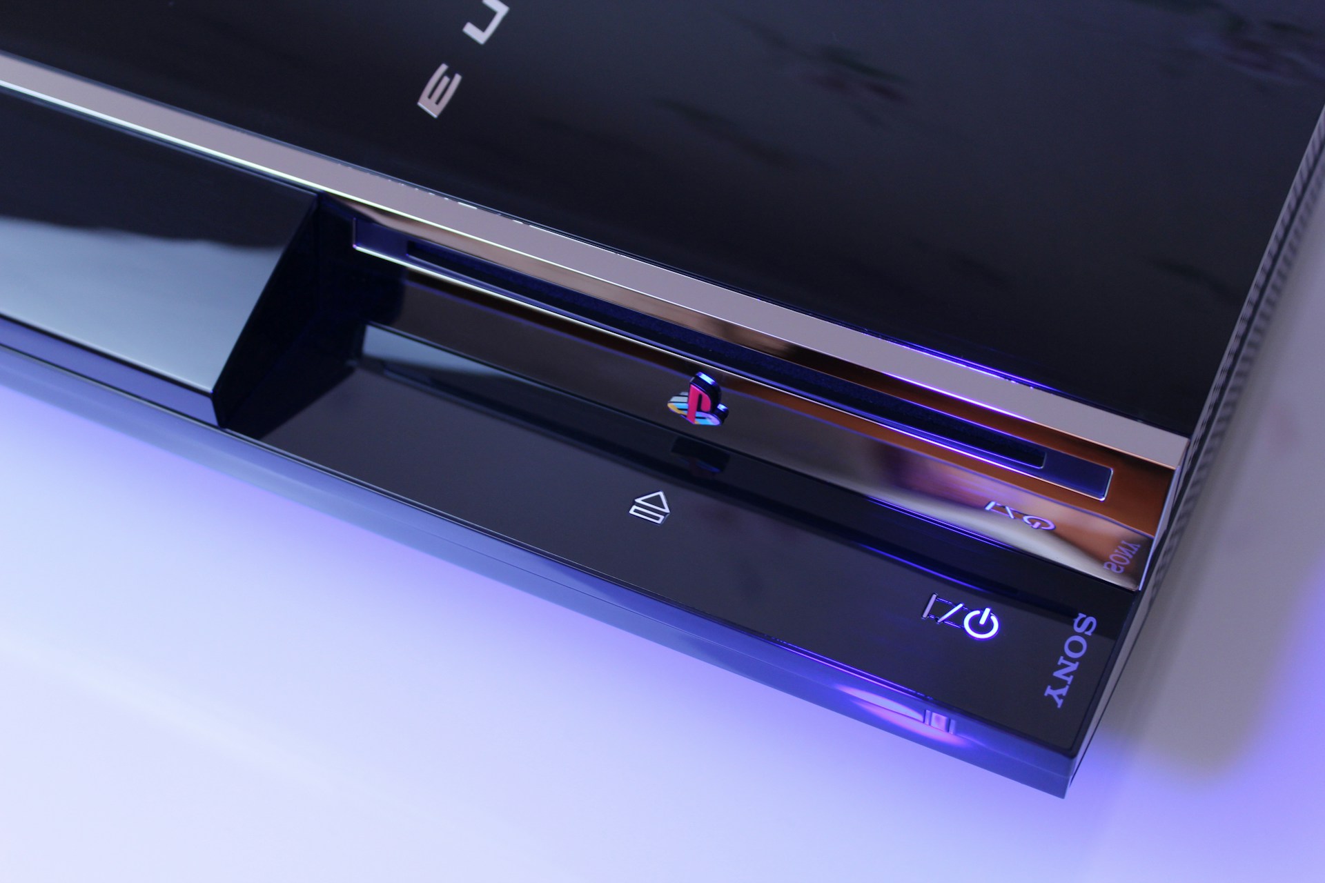 Sony PlayStation 3 console close-up with blue accent lighting